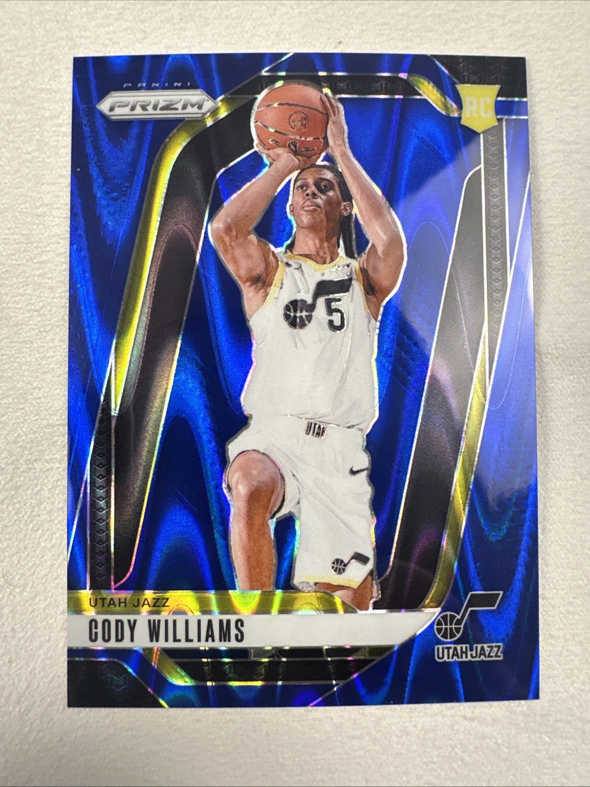 2024-25 Prizm Basketball - Blue Seismic /99 (RC) - Cody Williams #232