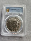 1934 Peace Silver Dollar graded by PCGS Genuine Cleaned AU Detail