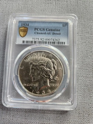1934 Peace Silver Dollar graded by PCGS Genuine Cleaned AU Detail