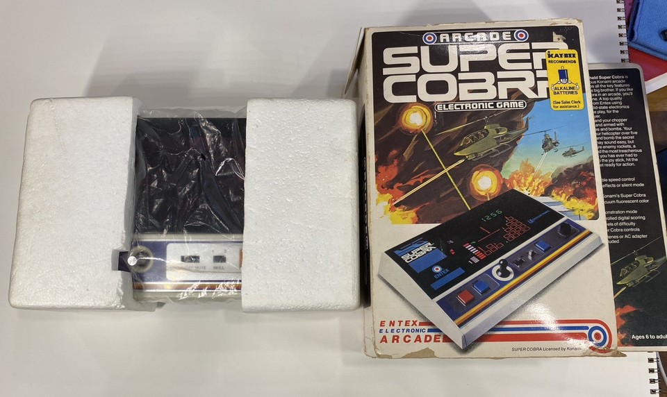 A MINT+ Entex Super Cobra in its original box is a rare, museum-quality 1981 handheld arcade relic that actually still works — you almost never see these.