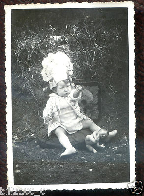 antique photograph. girl with her baby. celluloid bather.