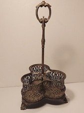 Antique silver plate Tantalus decanter holder.
