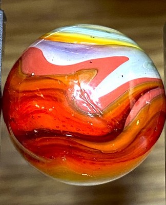 SUCH A CRAZY LOOKING MARBLE LOOKS LIKE RED SYRUP SWIRLED SHOOTER .71'' DD170