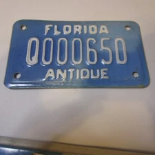 Florida Antique Motorcycle License Plate tag # Q000650  White/Blue Very Low #