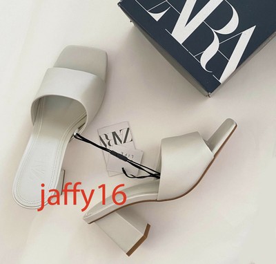 white leather heeled sandals