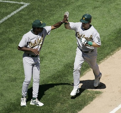 Mark Kotsay Oakland Athletics high five's 3rd base coach Ron Washi- Old Photo