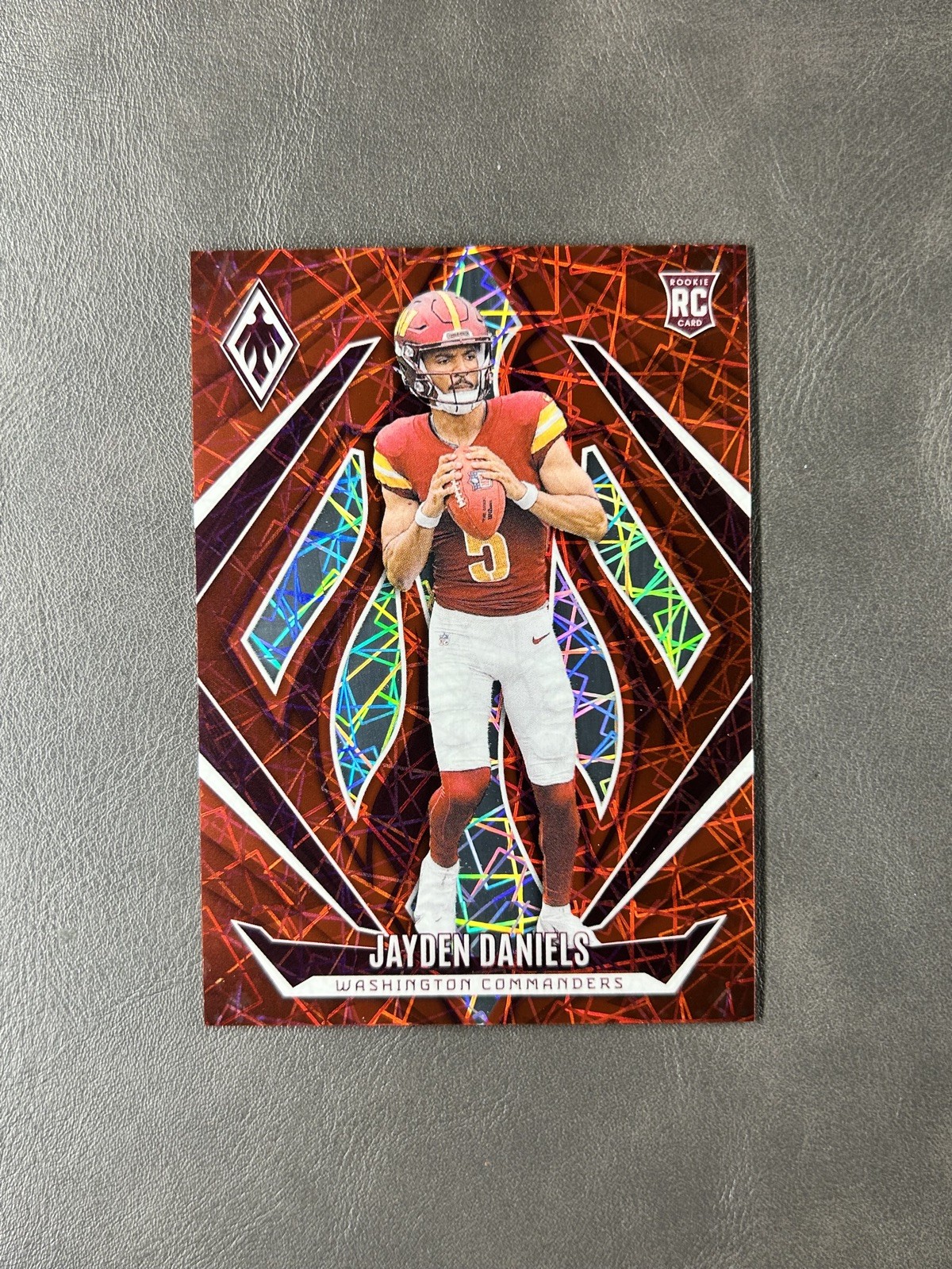 2024 Panini Phoenix Red Lazer /199 Jayden Daniels RC #198 Washington Commanders