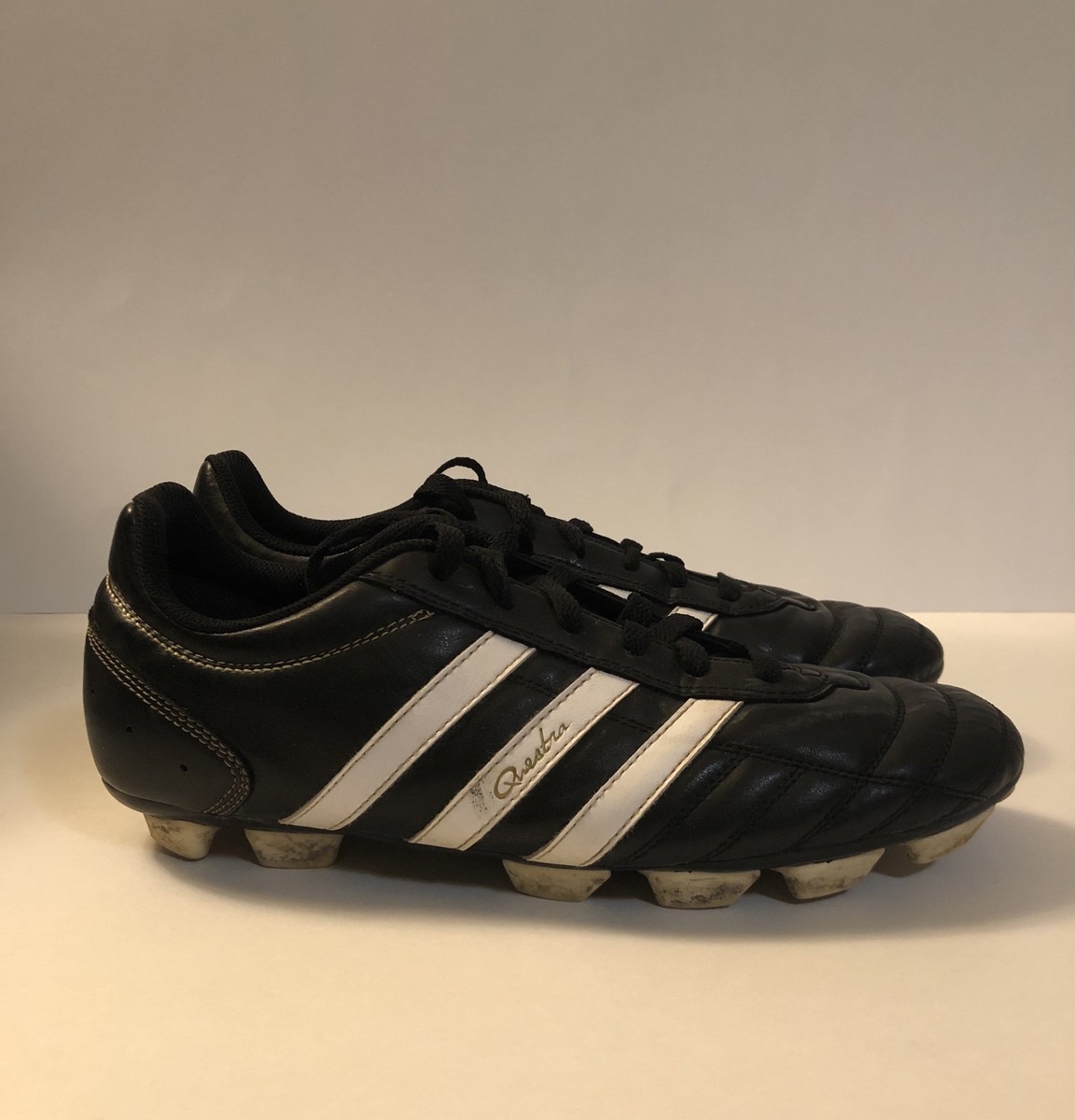Adidas Questra Soccer Cleats Traxion in classic black & white
