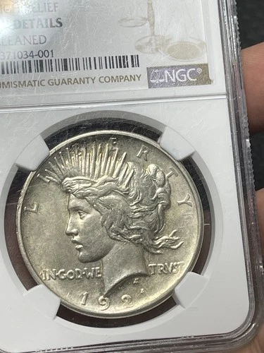 1921 $1 High Relief Peace Silver Dollar AU Detail Cleaned NGC Nice golden Toning