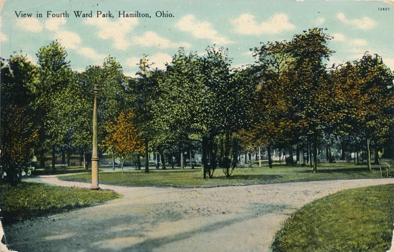 VIEW IN FOURTH WARD PARK, HAMILTON, OHIO. OH.  HOUSES IN BACK. ROADWAY.