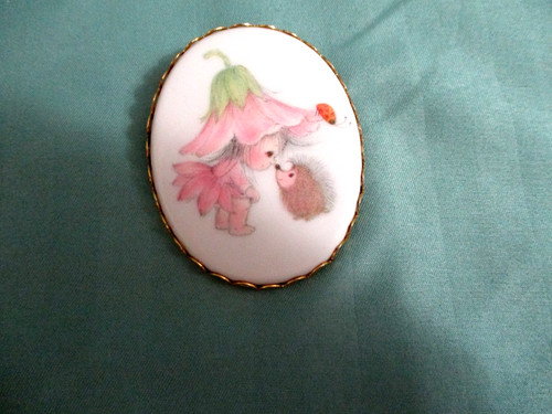 1973 Hallmark Pixie Girl w/ hedgehog porcelain/gold ton frame lapel pin