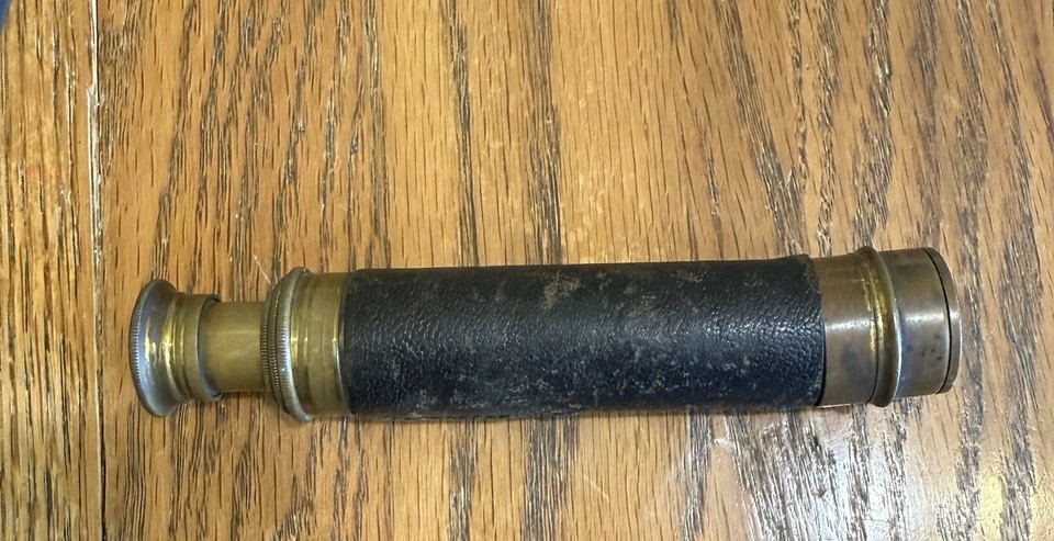 An 1800s Victorian 3-draw brass telescope with leather wrapping — the real deal in terms of age and craftsmanship, not a modern repro.