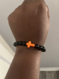 Black Beaded Stretch Bracelet with Orange Cross Charm | Christianity