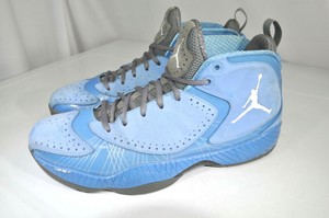 white and dark blue jordans