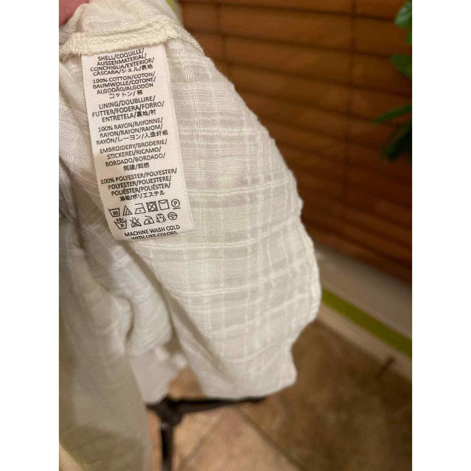 Free People’s white embroidered mini dress, xs Gem