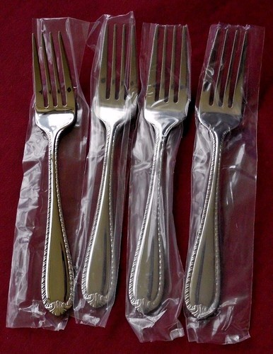 Set 4 coltelli da bistecca Reed & Barton acciaio inox 18/10 DOMAIN inutilizzati 2012  - Foto 6 di 8