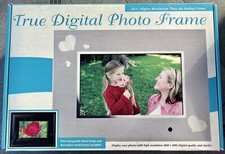 TRUE DIGITAL 7" PHOTO FRAME. JUST INSERT YOUR MEMORY CARD REMOTE INCLUDED NEW