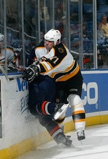 Jiri Slegr Boston Bruins throws a check v a New York Islande- Ice Hockey Photo