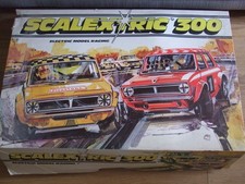 COMPLETE BOXED VINTAGE SCALEXTRIC 300 SET PLUS A LARGE BOX OF TRACK ETC.