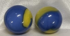 Akro Agate Corkscrew marble, featuring a blue corkscrew pattern on a yellow base
