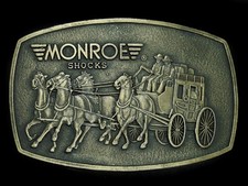 UC11132 NOS VINTAGE 1970s  MONROE SHOCKS  ADVERTISEMENT BELT BUCKLE