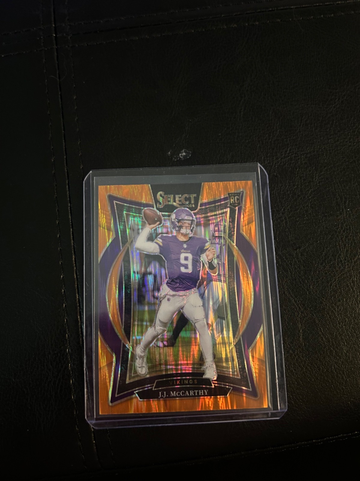 2024 Panini Select - Concourse J.J. McCarthy #24 Orange Shock Prizm /499 (RC)