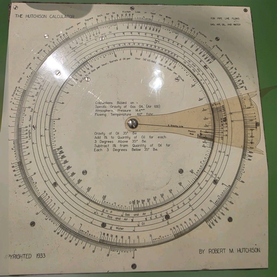 A 1933 circular slide rule purpose-built for pipeline flow calculations in the oil & gas industry — an insanely niche, 90-year-old analog computer that looks like a prop from a pulp sci-fi novel.