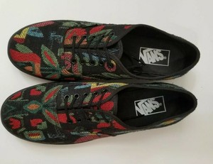 black vans with black soles