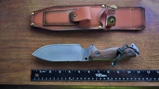 Fixed wide blade, full tang with wooden handle and leather belt loop sheath
