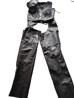 Leather motorcycle ensemble trimmed with fringe that includes chaps, vest, hat.