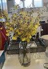 ARTIFICIAL YELLOW FLOWER ARRANGEMENT IN VASE-ACRYLIC WATER-H60x30cm NEW RRP$130