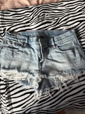 American Eagle Women  s Blue Light Wash Distressed SuperLow Rise Cut Off Shorts 4