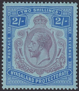 Nyasaland 1926 KGV 2sh Purple and Blue w Damaged Leaf Var Mint SG109f cat £200