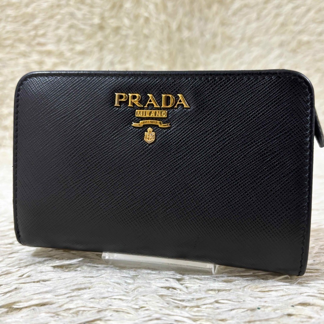 Prada Saffiano medium folding wallet with metal logo in black good condition
