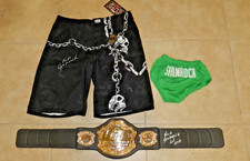 KEN SHAMROCK AUTOGRAPHED COLLECTION UFC BELT, 2 PAIR OF TRUNKS W/PROOF