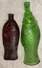 2 VINTAGE GLASS FISH SHAPED EMPTY WINE BOTTLES GREEN & BROWN GLASS