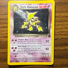 Original vintage 2000 holo Team Rocket Dark Alakazam 1/82 in MP condition on eBay