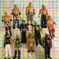 Lot Of 11 Basic WWE Action Figures.