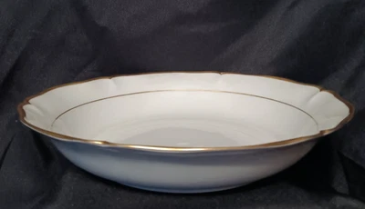 Grand plat rond creux en porcelaine de Limoges décor filet or - Photo 1/4