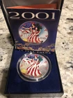 2001 AMERICAN EAGLE SILVER DOLLAR IN COLOR AND WITH A CASE