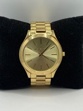 Reloj de cuarzo Michael Kors MK3179 para mujer con esfera analógica de acero inoxidable dorado JD200