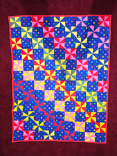 Hand made Baby Quilt, Circus look. dots and pin wheels