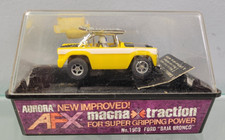 AURORA AFX 1909 FORD "BAJA BRONCO" YELLOW HO Slot Car BANDED IN ORIGINAL CUBE