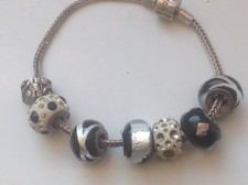 "RHONA SUTTON "SOLID SILVER BRACELET (7 RHONA SUTTON CHARMS) GIFT BOXED VGC