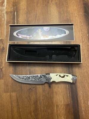 Wolf etched display knife with box.  The Knife is 11  Overall.