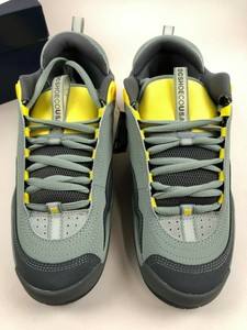 gray and yellow shoes