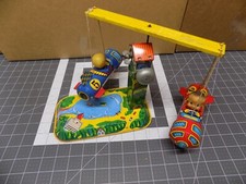 Vintage Yone Japan Mechanical Amusement Park Rocket Merry Go Round Tin Litho Toy