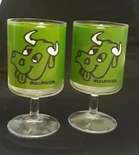 PAIR of  vintage Tabasco Bulldozer promo Glasses. RARE!  Wolfschmidt vodka. 