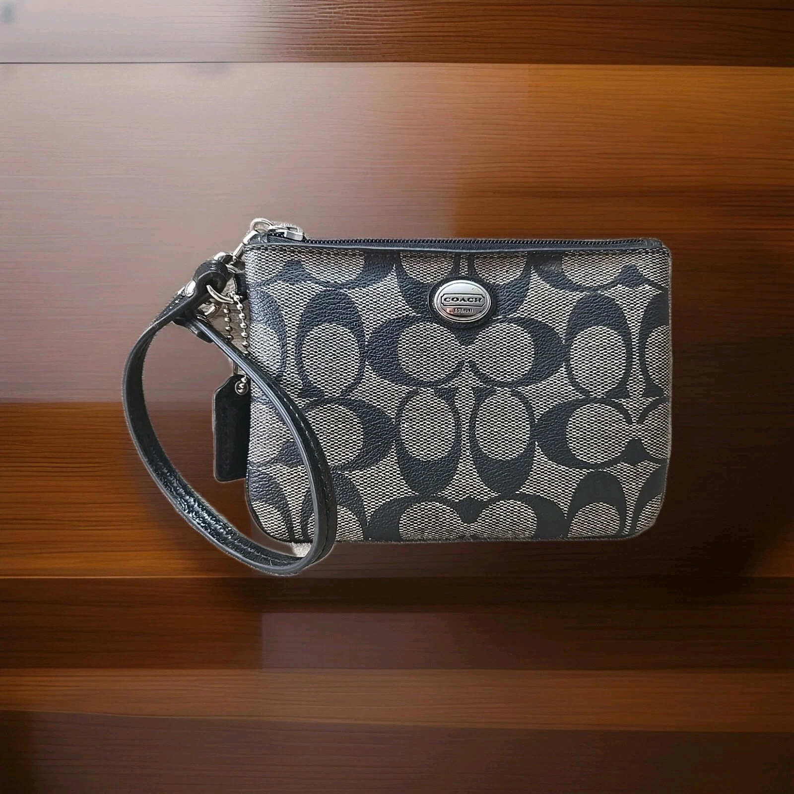 Portafoglio piccolo Coach con logo firmato da polso nero PVC