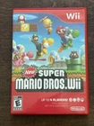 New Super Mario Bros. Nintendo Wii 2009 Complete with Manual - Tested & works!